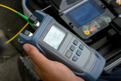 testing device held in a workers hand